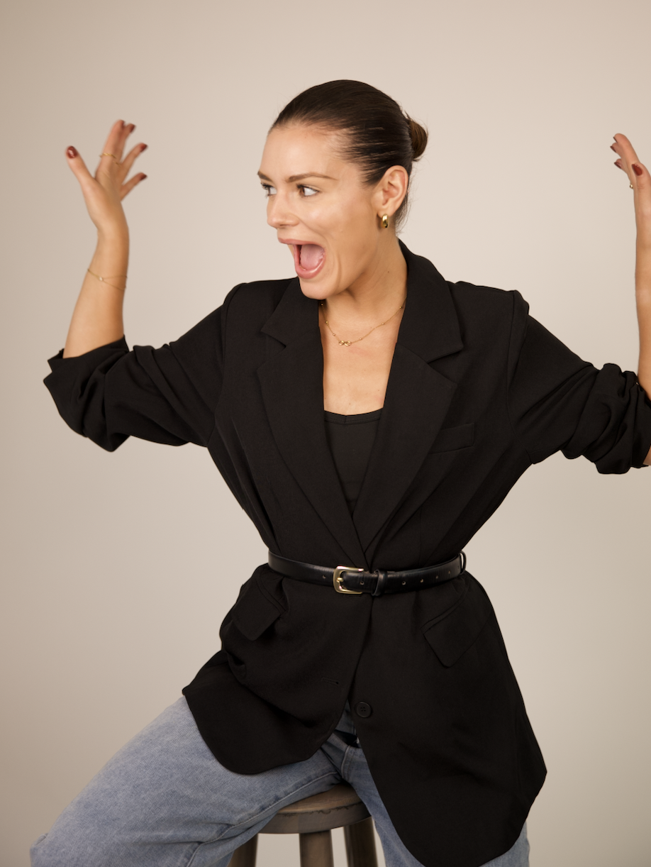 Moody Treats founder laughing with her hands in the air